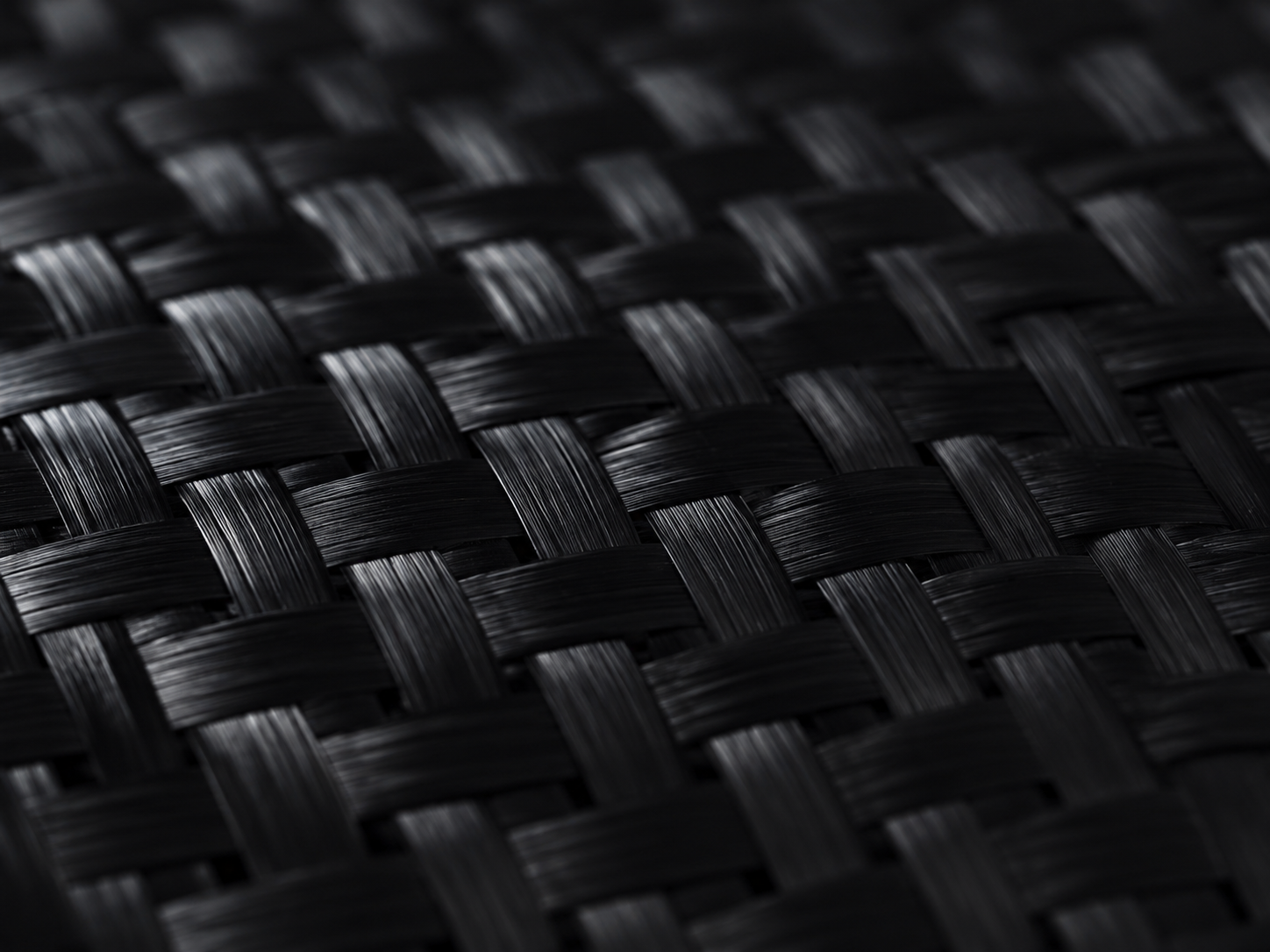 Macro detail of woven carbon fibre twill